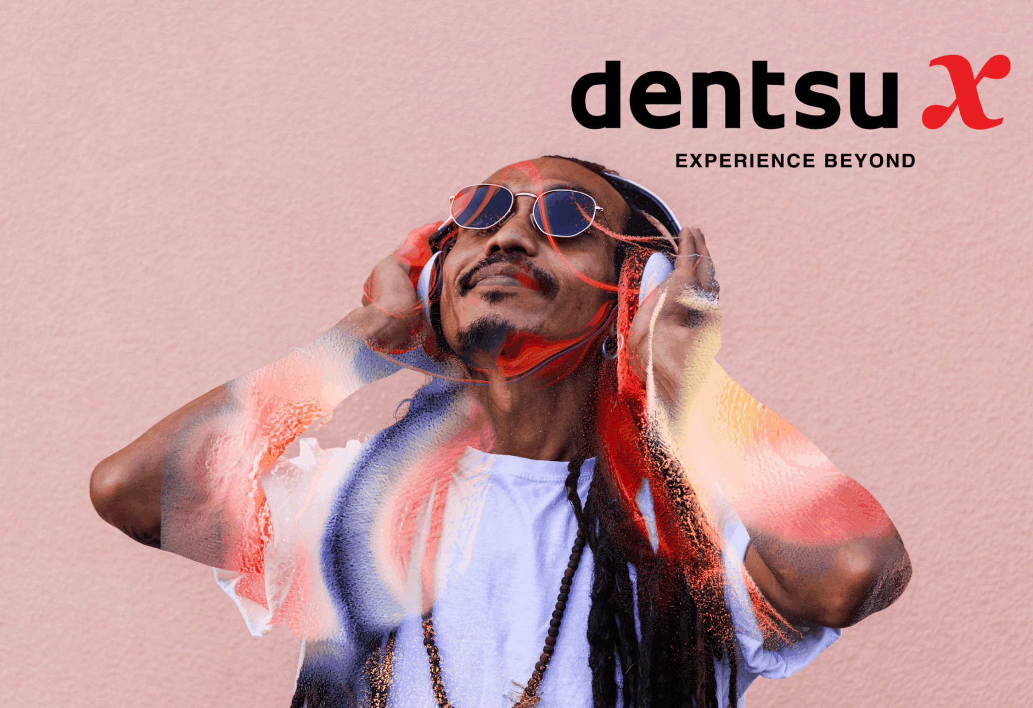 image of man listening to music in headphones dentsu x