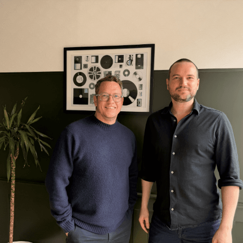 image of two men standing together