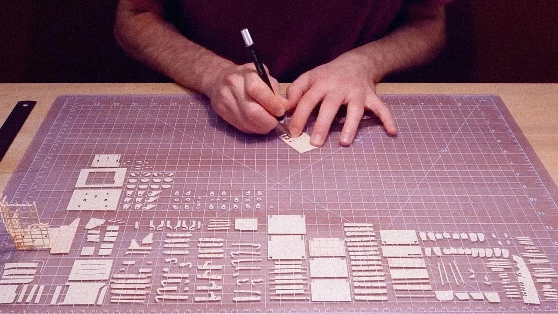 Paper aircraft parts laid out during Singapore Airlines model build