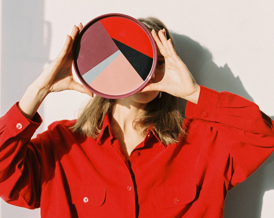 Image of a Woman Holding a Colorful Wheel