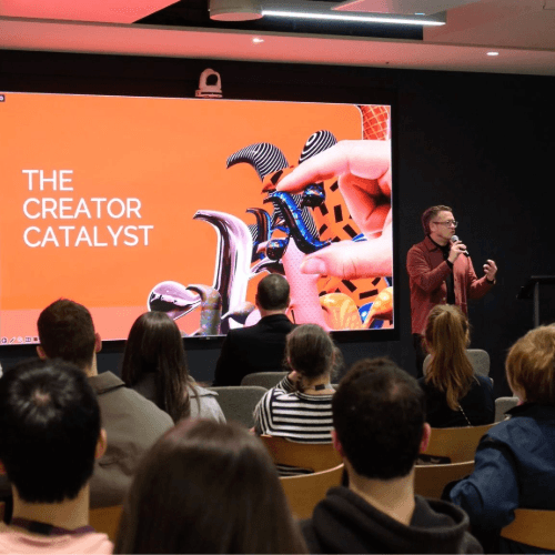 image of presentation screen "The Creator Catalyst" and audience