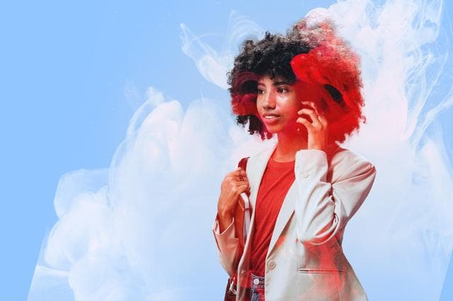 woman holding mobile phone to ear