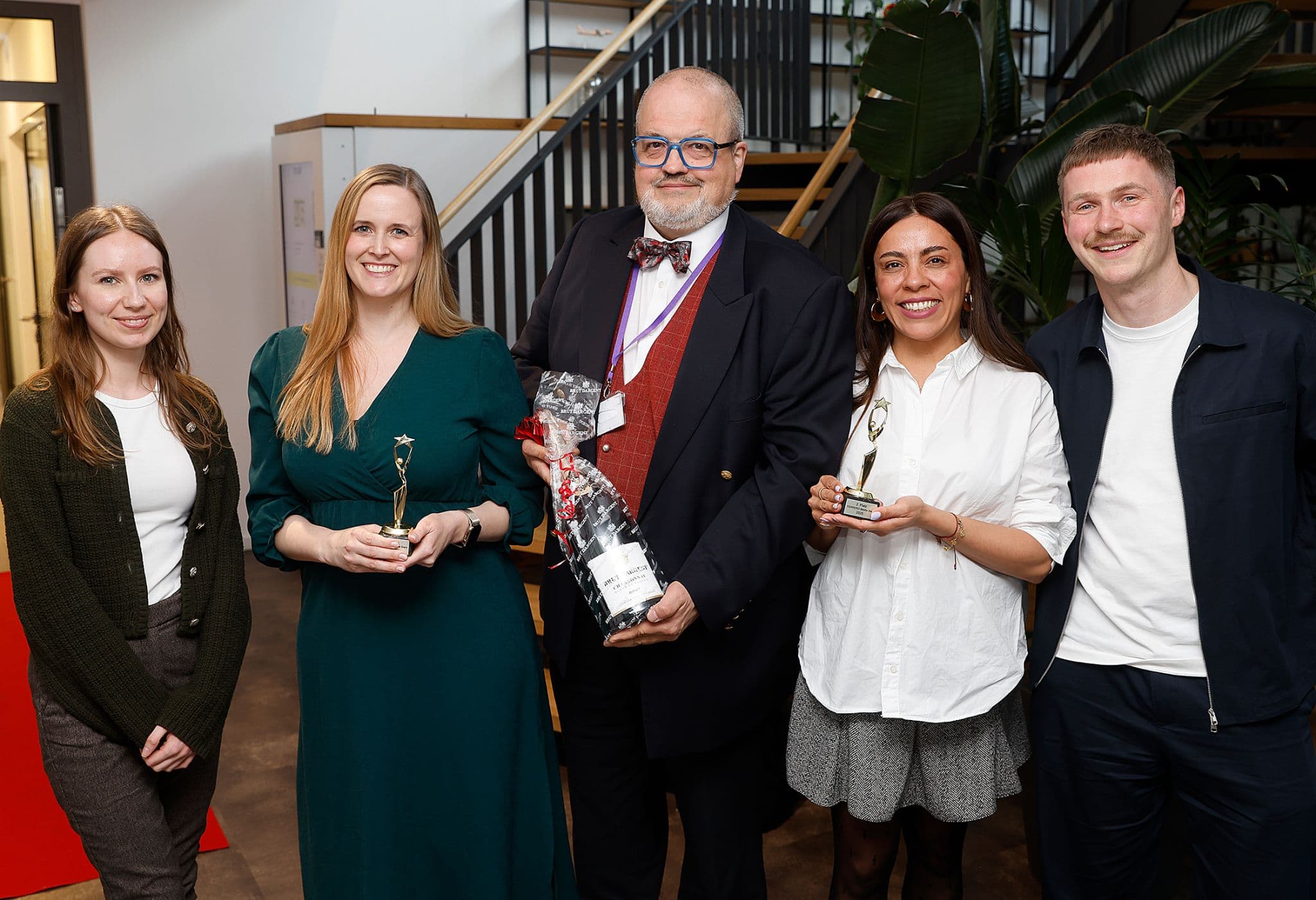 image of 5 colleagues posing with ferrero stars award dentsu x germany