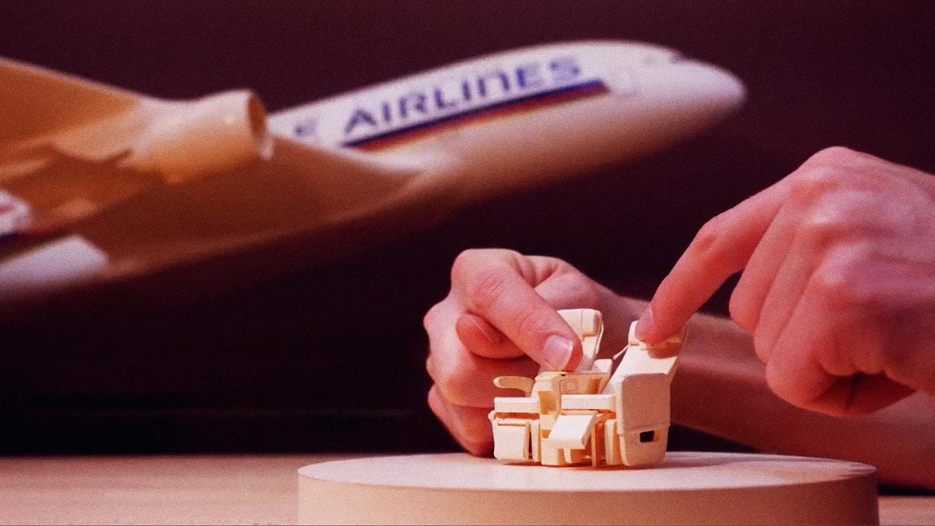 Paper aircraft parts laid out during Singapore Airlines model build