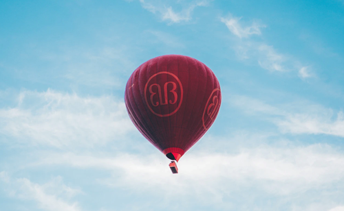 Brand name on hot air balloon - dentsu X US